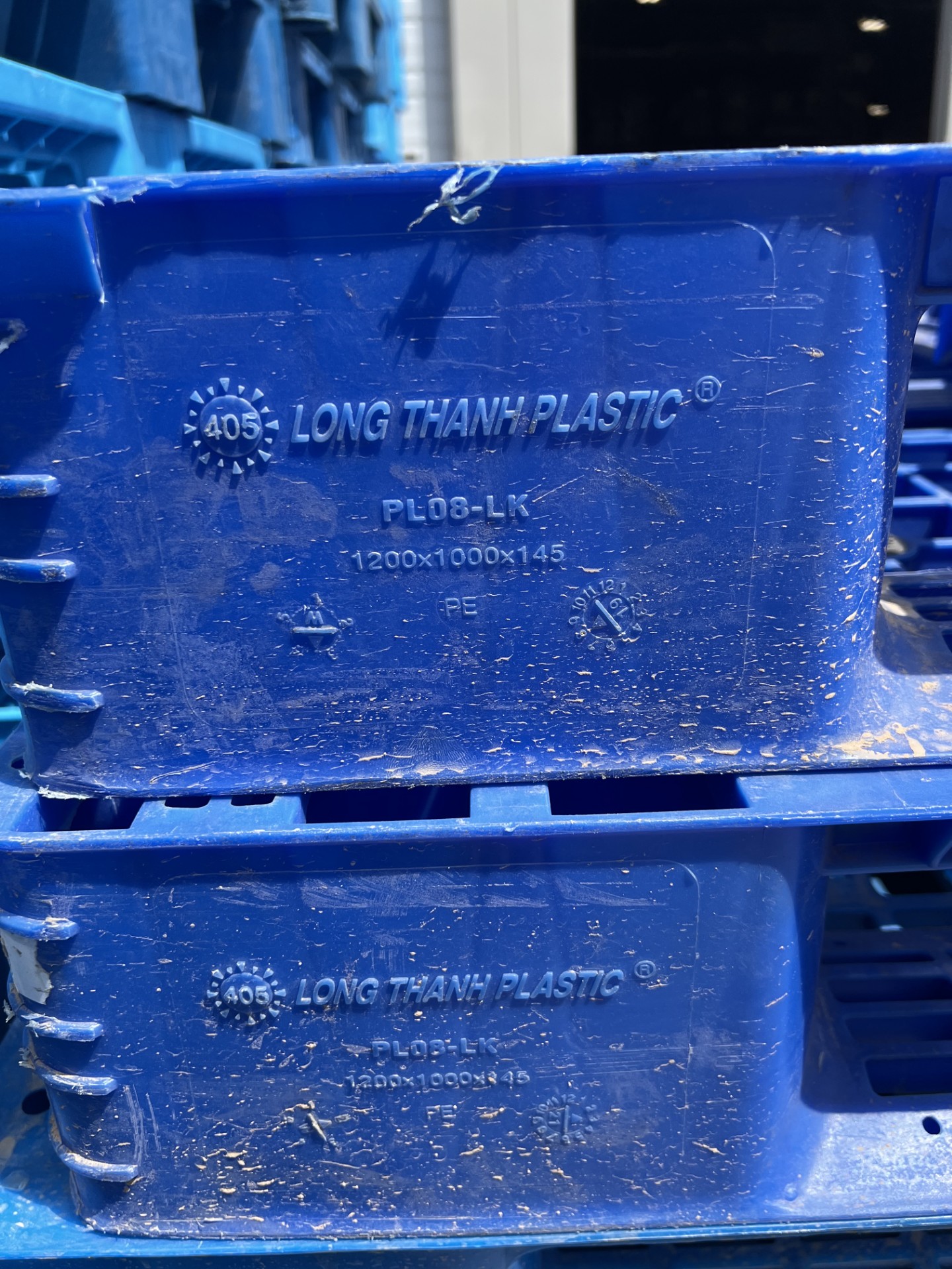 Stacks of blue plastic pallets at our Phoenix yard